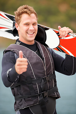 Buy stock photo Sports, thumbs up and portrait of man with wakeboard for surfing, exercise and recreation hobby by lake. Fitness, emoji hand sign and person with board for water skiing for freedom, adventure and fun