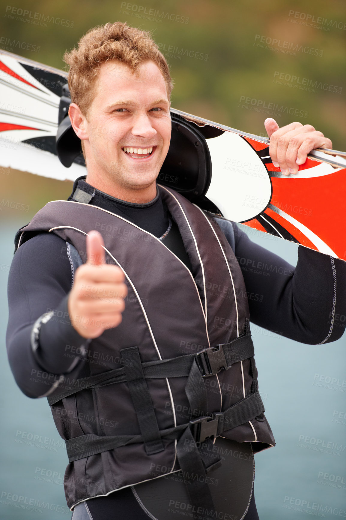 Buy stock photo Sports, thumbs up and portrait of man with wakeboard for surfing, exercise and recreation hobby by lake. Fitness, emoji hand sign and person with board for water skiing for freedom, adventure and fun