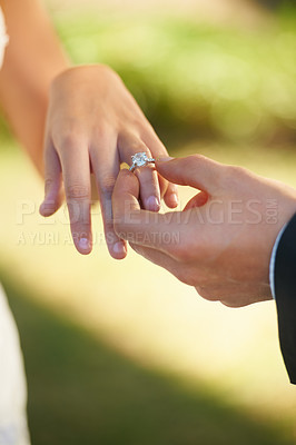 Buy stock photo Closeup, wedding and hands with a ring, couple or love ceremony with happiness, commitment or loving. Zoom, groom or bride with engagement event, save the date or jewelry with marriage or partnership
