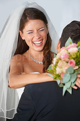 Buy stock photo Laughing, bride and groom in embrace at wedding with fun, love and commitment at reception. Smile, face of woman and man hugging at marriage celebration with happiness, loyalty and future together.