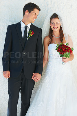 Buy stock photo Portrait of a newlywed couple smiling happily on their wedding day