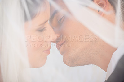 Buy stock photo Veil, man and woman kiss at wedding with romance, love or commitment at luxury reception. Fabric, face of bride and groom in embrace at marriage celebration with happiness, loyalty or future together