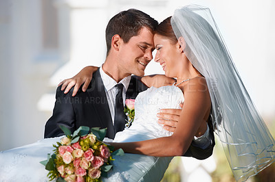 Buy stock photo Wedding, marriage or carry with a bride and groom in celebration outdoor as a newlywed married couple. Smile, romance and tradition with a man carrying a woman over the threshold after a ceremony