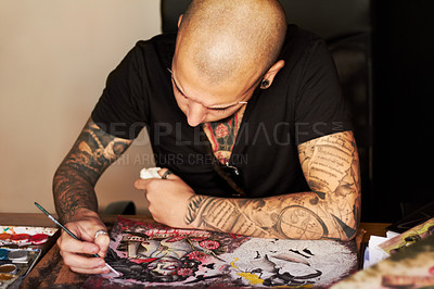 Buy stock photo A young man drawing a tattoo design