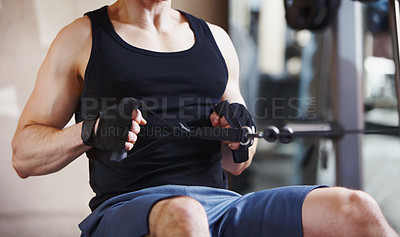 Buy stock photo Cropped image of a mature man using the cable row machine at the gym