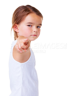 Buy stock photo Portrait, vote and pointing with a serious child in studio isolated on a white background for choice. Kids, blame or accuse and a young girl with a gesture for decision or option on vertical space