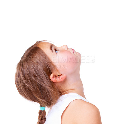 Buy stock photo Face, thinking and looking up with a girl child in studio isolated on a white background for inspiration. Mockup, idea and space with adorable little kid for problem solving, curious or contemplation