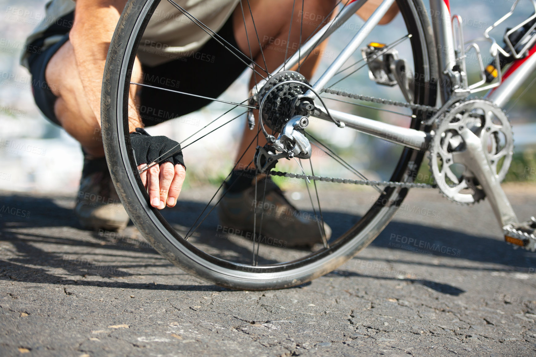 Buy stock photo Check, wheel and hand on bicycle with road, street and outdoor exercise with flat tire. Cycling, athlete and closeup on safety, inspection and test for bike with person on asphalt with pedal or gears