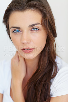 Buy stock photo Portrait, beauty and cosmetics with a natural woman in studio on a white background for skincare or wellness. Face, skincare and hair with a confident young model at the salon for glow or shine