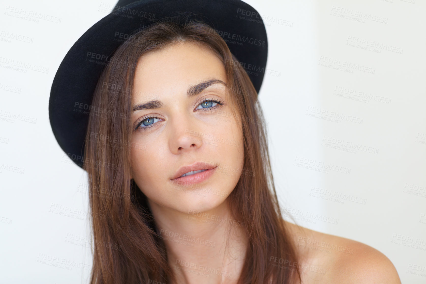 Buy stock photo Attractive woman, portrait and face in fashion, beauty or cool style with hat against a white studio background. Gorgeous young female person or model looking with blue eyes and long hair on mockup