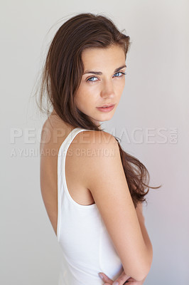 Buy stock photo Rearview portrait of a casually dressed young woman