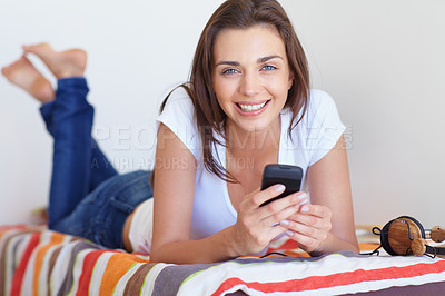 Buy stock photo Smile, bed and girl in morning with phone, checking email or social media post in home weekend. Relax, rest and communication, happy woman with smartphone and scroll in apartment, house or bedroom.