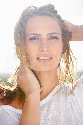 Buy stock photo Portrait of a beautiful young woman standing outside