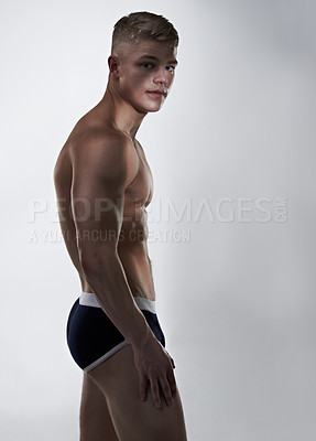 Buy stock photo Toned young man posing in his briefs