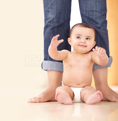 Buy stock photo Baby, mother and feet with sitting on floor for playing, child development and parenting with happiness. Kid, infant and diaper on ground with legs, smile and playful for growth, nurture and care
