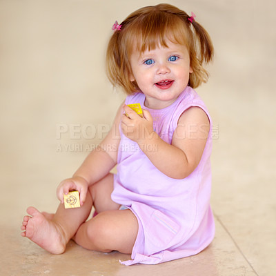 Buy stock photo Portrait, toddler or little girl with toy in home for motor skills, child development or growth. Happy kid, cute and trendy hairstyle with hand holding for block for grip with milestone for future
