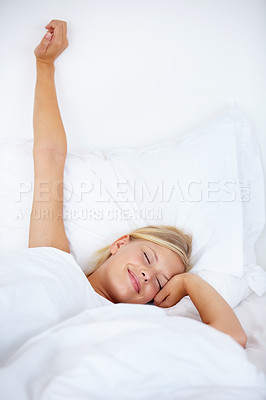 Buy stock photo Morning, wake up and stretching with a woman in bed to relax, feeling fresh after a sleep from above. House, sleeping and smile with a happy young female lying in her bedroom on a comfortable pillow