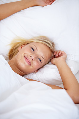 Buy stock photo Person, portrait or wake up in home bedroom for relax, sleeping and weekend rest. Smile, awake or happy woman lying or stretching in house, hotel or apartment bed for comfort break in morning rotine