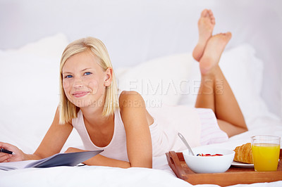 Buy stock photo Woman, bed and notebook with breakfast, morning and writing in diary, smile and bedroom for journaling. Food, fruits and croissant with orange juice, nutrition or healthy diet in home, rest or happy