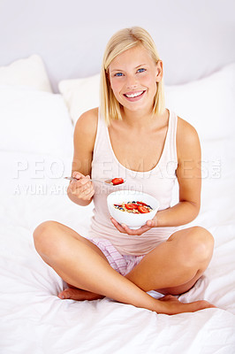 Buy stock photo Portrait, home and woman with breakfast, bowl  and bedroom with cereal, natural nutrition and wellness. Person, apartment and girl with diet, fruit and holding organic strawberry to lose weight