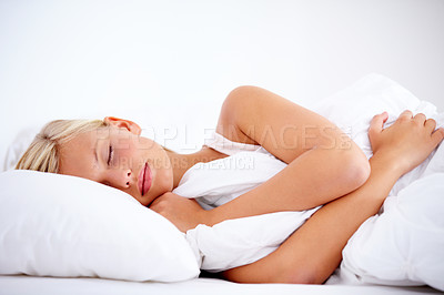 Buy stock photo Gorgeous young woman peacefully sleeping comfortably on white linen
