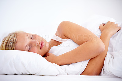 Buy stock photo Bedroom, woman and sleeping with peace, relax or home with comfort, tired or resting while dreaming. Mockup space, fatigue sleep or exhausted person, taking a nap with a comfortable pillow or blanket