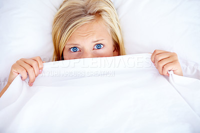 Buy stock photo Young blonde woman covering half her face with a white sheet - portrait
