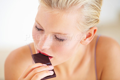 Buy stock photo Relax woman, face and eating dark chocolate for antioxidants benefits, morning wellness or stress relief food. Diet cheat meal, eyes closed and person enjoy sugar craving, cacao bar or sweets slab