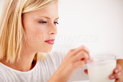 Buy stock photo Woman, drink and milk thinking for nutrition or glass, white background as studio mockup. Female person, dairy and breakfast smoothie for calcium as healthy vitality or milkshake, protein or diet