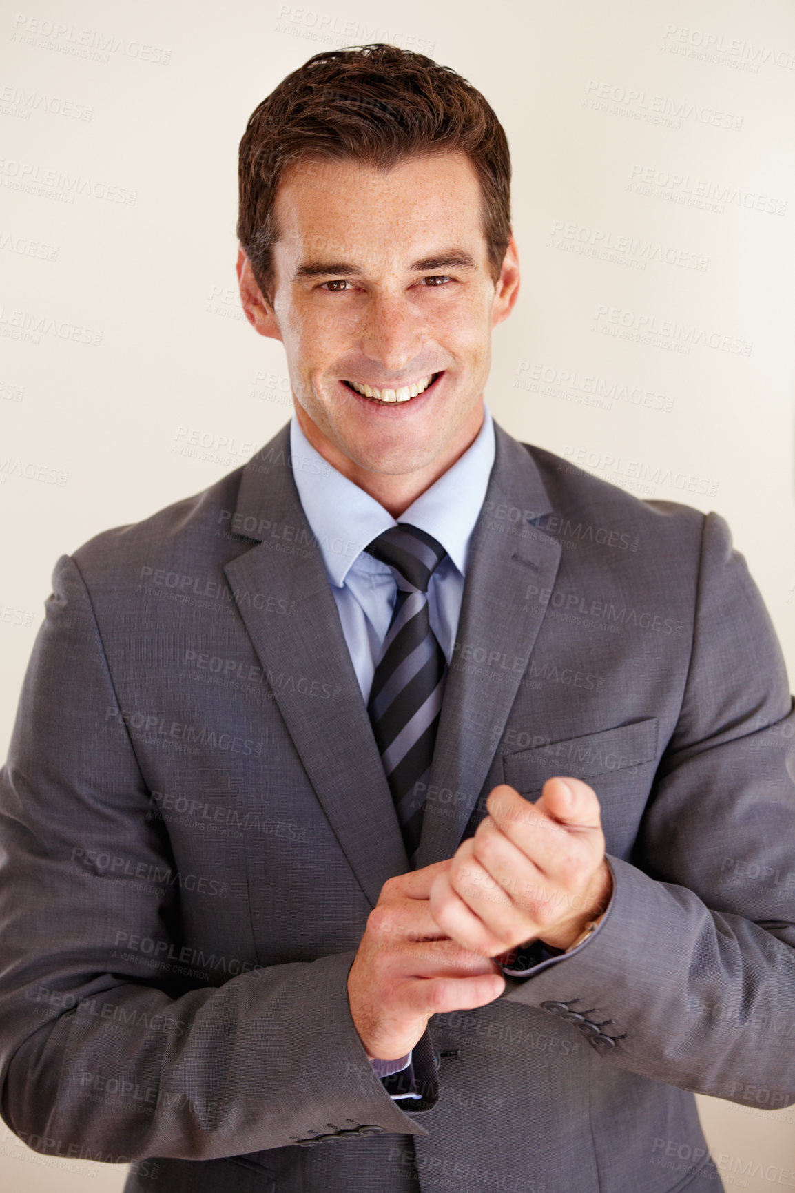 Buy stock photo Studio shot of a handsome businessman posing against a white background
