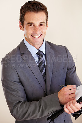 Buy stock photo Portrait of a handsome young man taking business notes
