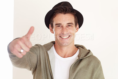 Buy stock photo Portrait, man in studio and thumbs up for fashion, celebrate sales promotion and winning on white background. Happy hipster, deal or emoji for excellence, thank you and yes to feedback for cool style