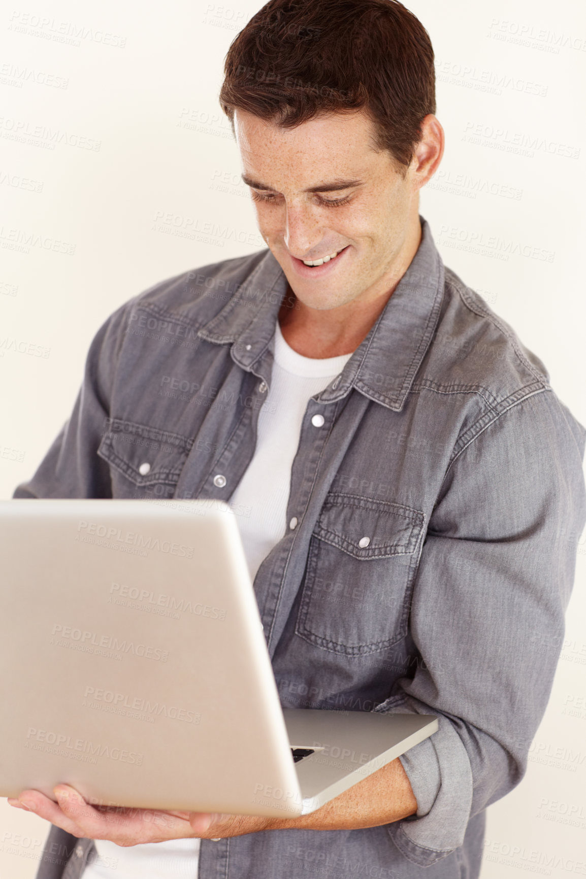 Buy stock photo Man, laptop and smile in studio for remote work, elearning and search subscription for digital download on white background. Happy freelancer typing on computer to update blog, online shopping or web