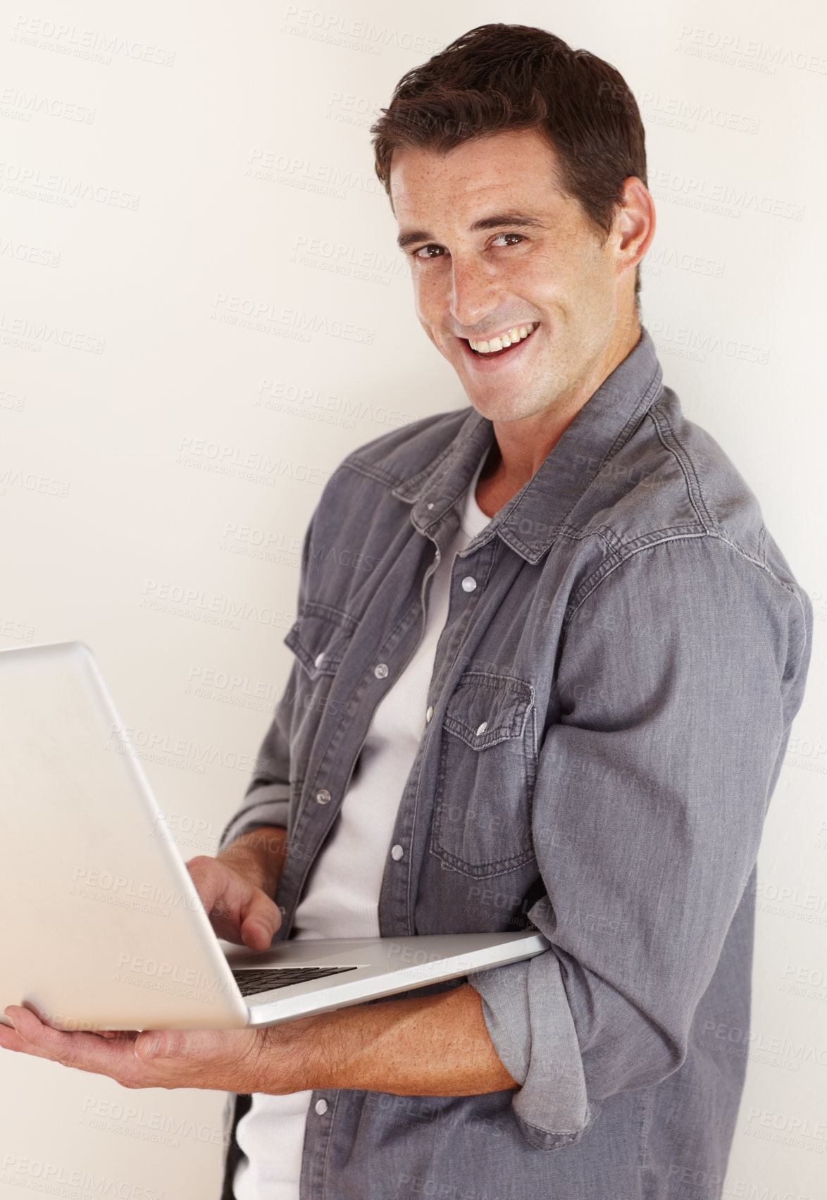 Buy stock photo Man, laptop and portrait in studio for remote work, social media and search subscription for digital download on white background. Happy freelancer, computer and blog connection for online shopping