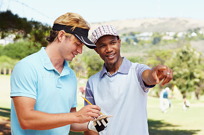 Buy stock photo Sports, golf and athletes in discussion on field writing notes for competition or tournament strategy. Fitness, smile and professional happy male players talking for hobby on an outdoor course.