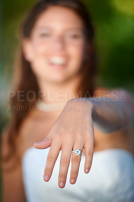 Buy stock photo Bride, woman and hand with wedding ring outdoor for marriage, commitment and celebration with diamond. Love, unity and person in nature with jewelry for ceremony, smile and support on park in summer