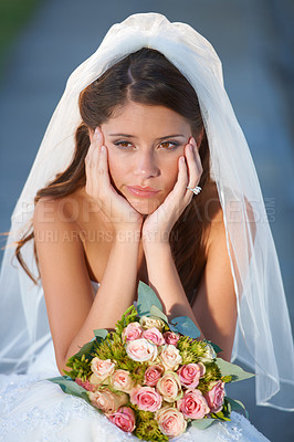 Buy stock photo Wedding, woman and bride with bouquet for thinking, unhappy and disappointed with ceremony, commitment or event. Marriage, person and face with feeling down, sadness and gloomy outdoor in nature