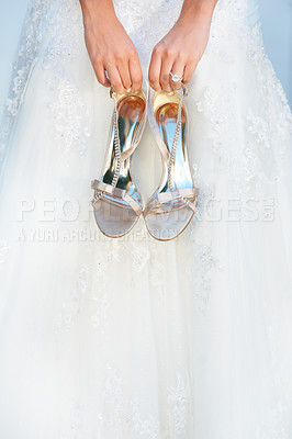 Buy stock photo Hands, wedding and closeup of a bride with shoes and dress for luxury, elegant and romantic event. Zoom of woman with silver, fashion and bridal heels and garments marriage ceremony or celebration. 