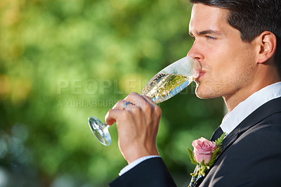 Buy stock photo Wedding, nature and groom drinking champagne for romantic celebration, party or event. Garden, alcohol and young man in a suit with sparkling wine at luxury, elegant and fancy marriage ceremony.