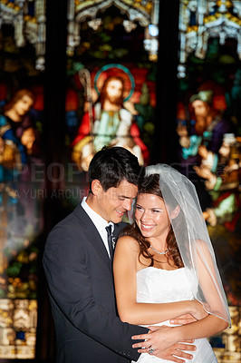 Buy stock photo Happy couple, hug and wedding in church for marriage love or vow in commitment together. Married man or groom hugging woman or bride with smile for embrace, loyalty or support in trust at ceremony