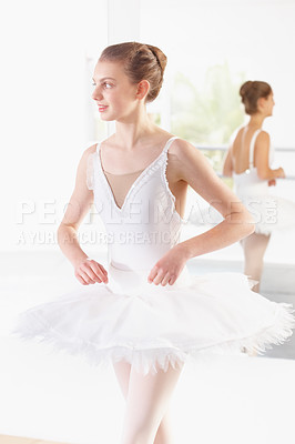 Buy stock photo Tutu, mirror and girl in ballet studio with pose, balance and performance class for happy kid dancer. Smile, art and young ballerina with pride, confidence and thinking at dance academy for children.