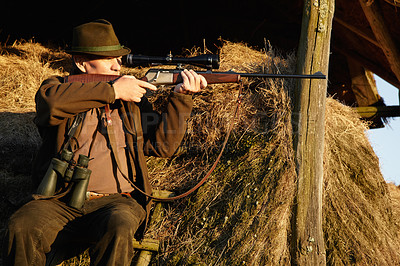 Buy stock photo Hunter, safari gun and man shooting with aim at sunrise at a wildlife lookout for hunting. Target, weapon and game sports of a male person outdoor in nature with a gun to shoot wild and animals