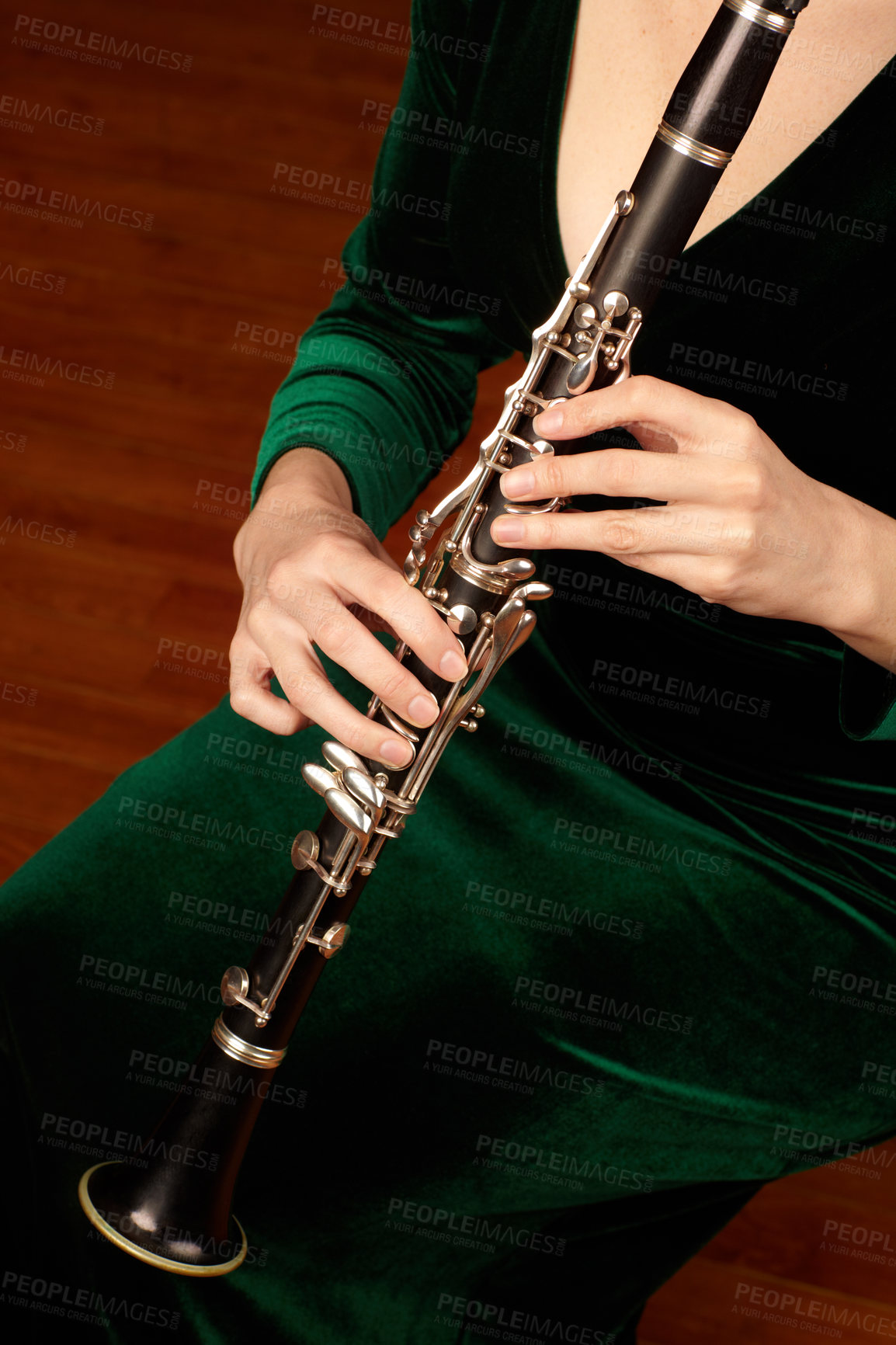 Buy stock photo A cropped image of a woman playing a clarinet