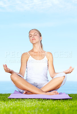 Buy stock photo Woman, yoga and meditation in park for peace, calm and mental health or wellness and mindfulness. Young and zen person relax with outdoor lotus pose, spiritual care and chakra on blue sky background