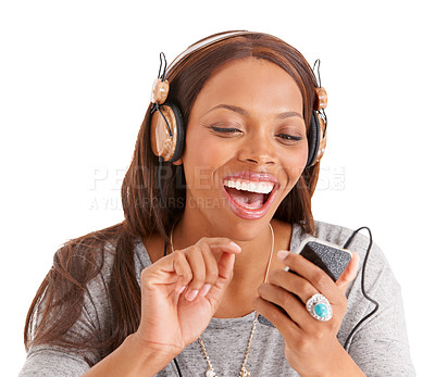 Buy stock photo Happy black woman, phone and laughing for funny joke, meme or social media against a white studio background. African female person on mobile smartphone app with headphones for comedy entertainment