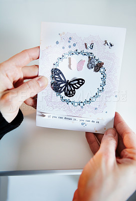 Buy stock photo Cropped shot of a woman's hands holding a hand-made card