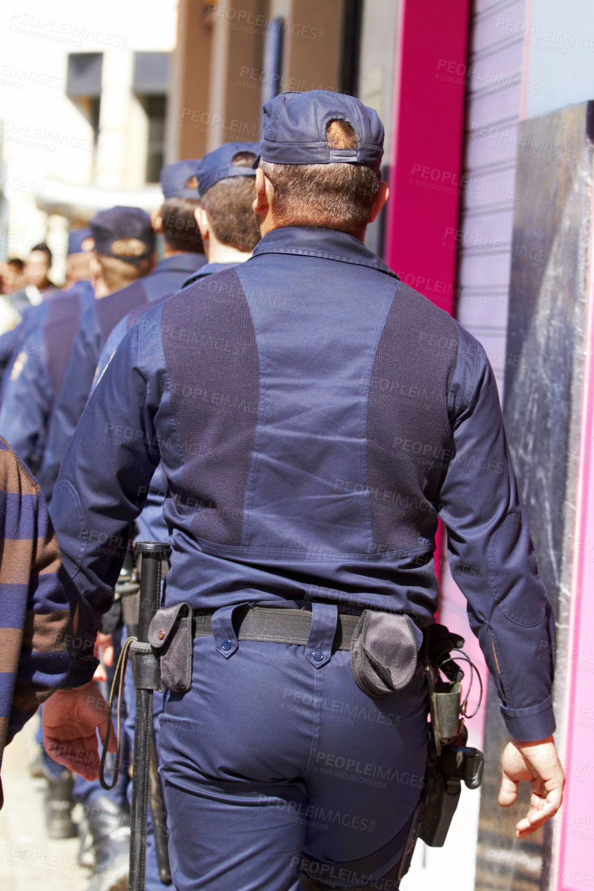 Buy stock photo Police, group and walking in city for safety, law enforcement and urban patrol from the back. Security, team of people and public service cops with legal power, authority and crime guard in street