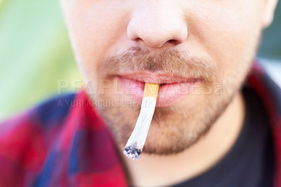 Buy stock photo Cigarette, smoke and man with a tobacco habit and addiction due to unhealthy or bad lifestyle outdoor. Mouth, cancer and lips of young person or male smoker with substance or healthcare problem