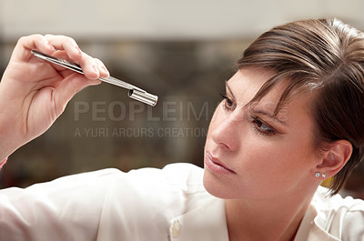 Buy stock photo Forensic scientist, woman and bullet investigation for finger print, dna and research. Focus, female professional and investigator on a crime scene with gun shell and lab work for detective case