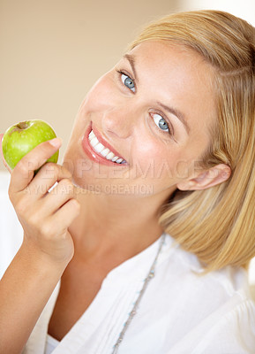 Buy stock photo Happy woman, holding and apple in portrait for health, nutrition or wellness. Female person, smile and fruit in hand for wellbeing, vitamin or fibre with choice for natural, fresh or organic diet